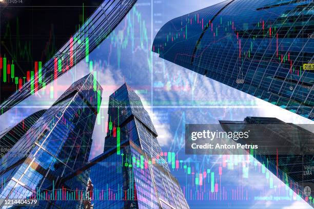 stock charts on the background of skyscrapers. financial system concept - city of detroit teeters on bankruptcy as state audits its finances stockfoto's en -beelden