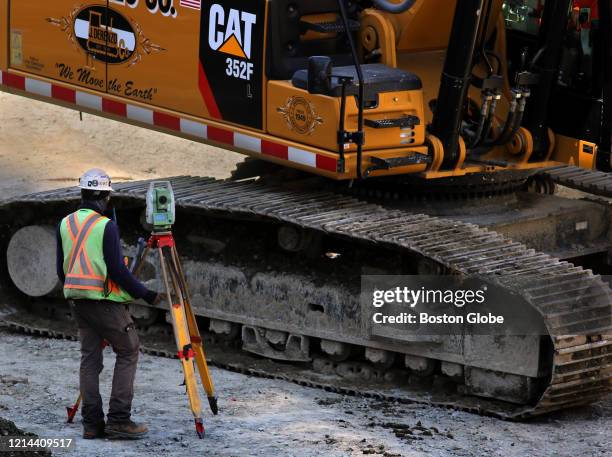 Workers are back on the job at the the construction site of new towers near Government Center in downtown Boston on May 19, 2020. As the state...