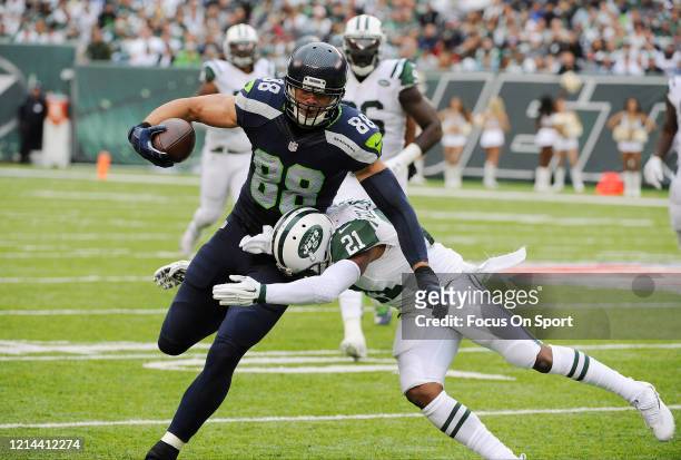 Jimmy Graham of the Seattle Seahawks fights off the tackle of Marcus Gilchrist of the New York Jets during an NFL football game October 2, 2016 at...