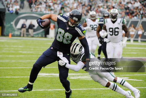 Jimmy Graham of the Seattle Seahawks fights off the tackle of Marcus Gilchrist of the New York Jets during an NFL football game October 2, 2016 at...