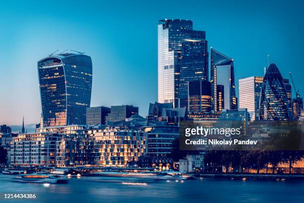 city of london's financial district during late hours of the day as seen from london city hall - creative stock image - london england stock pictures, royalty-free photos & images