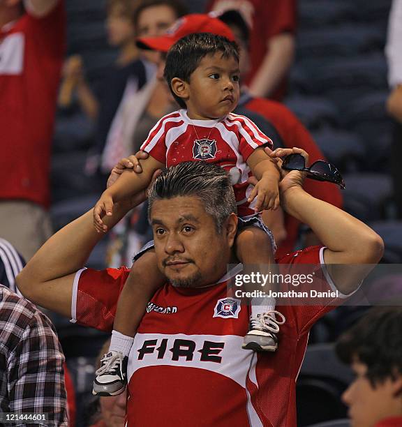 Fans of the Chicago Fire watch as the Fire takes on D.C. United during an MLS match at Toyota Park on August 18, 2011 in Bridgeview, Illinois. The...