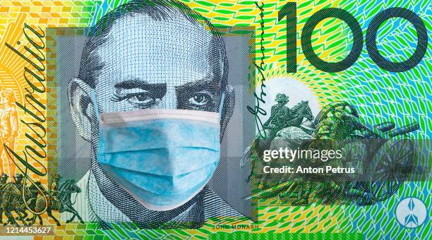 australia quarantine, 100 dollar banknote with medical mask. the concept of epidemic and protection against coronavrius. - cash australia stock pictures, royalty-free photos & images