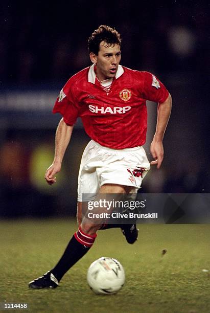 Bryan Robson of Manchester United on the ball in the FA Cup Semi-Final replay against Oldham Athletic at Old Trafford in Manchester, England. United...