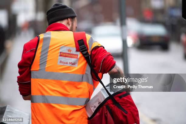 Postal worker from behind on March 17, 2020 in Cardiff, United Kingdom.