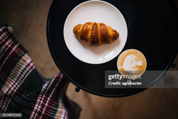 coffee and croissant in cozy place - french croissant stock pictures, royalty-free photos & images