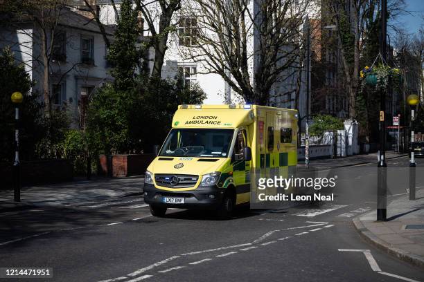 London, United Kingdom An ambulance passes over the iconic Abbey Road pedestrian crossing on March 24, 2020 in London, England. British Prime...