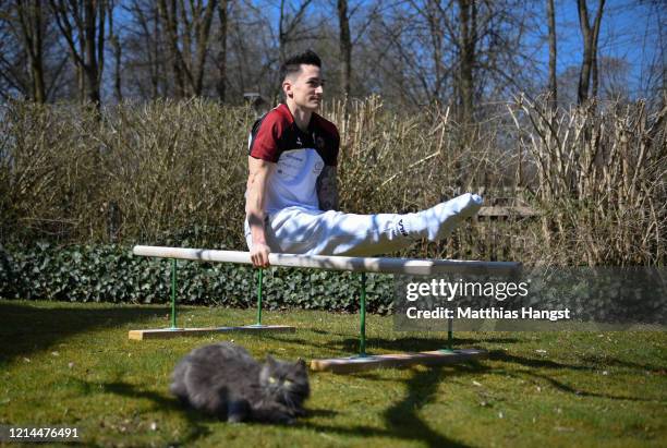 German gymnast Marcel Nguyen continues training for the Tokyo 2020 Olympics at his mother's garden on March 24, 2020 in Unterhaching, Germany. The...