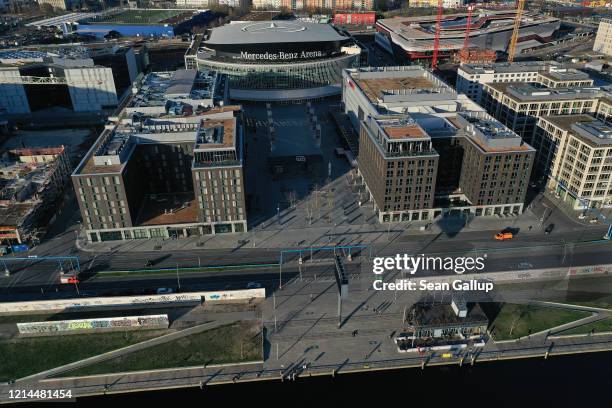 In this aerial view the plaza in front of the Mercedes-Benz Arena, which under normal circumstances draws visitors to its shops and restaurants,...