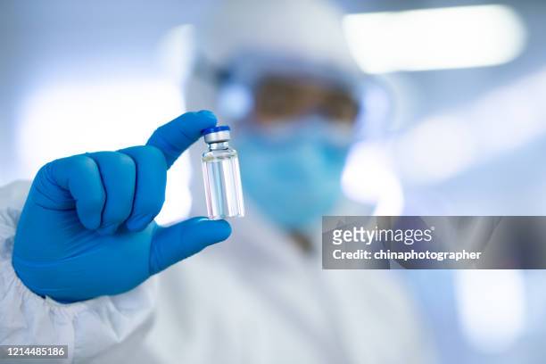 covid-19 vaccine development - antibiotic injection stock pictures, royalty-free photos & images