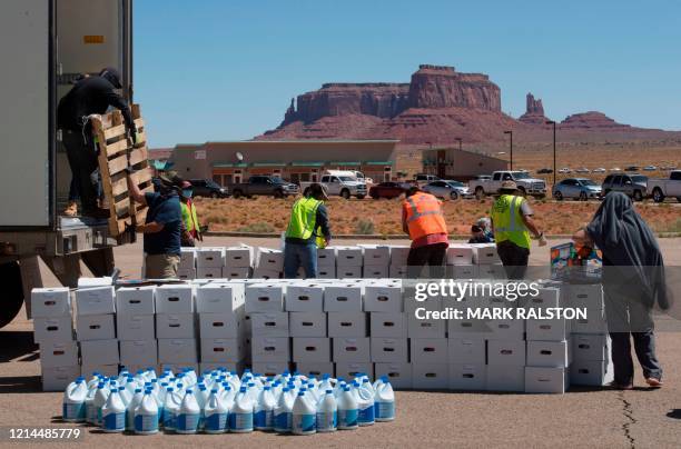 Navajo Nation volunteers prepare food boxes for distribution to families in need outside Monument Valley Tribal Park, which has been closed due to...