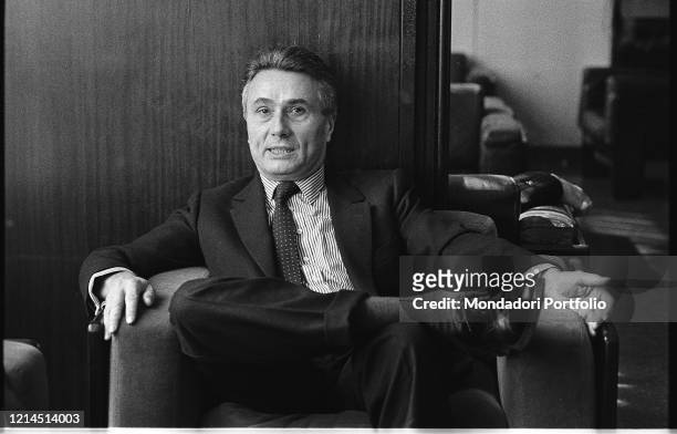 Italian writer, journalist, poet, theater critic and politician Alberto Arbasino sitting on an armchair. Rome , March 6th, 1987