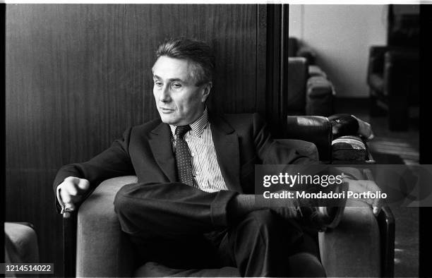 Italian writer, journalist, poet, theater critic and politician Alberto Arbasino sitting on an armchair. Rome , March 6th, 1987