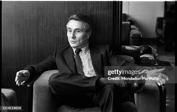 Italian writer, journalist, poet, theater critic and politician Alberto Arbasino sitting on an armchair. Rome , March 6th, 1987