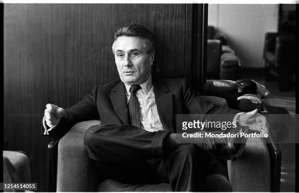 Italian writer, journalist, poet, theater critic and politician Alberto Arbasino sitting on an armchair. Rome , March 6th, 1987