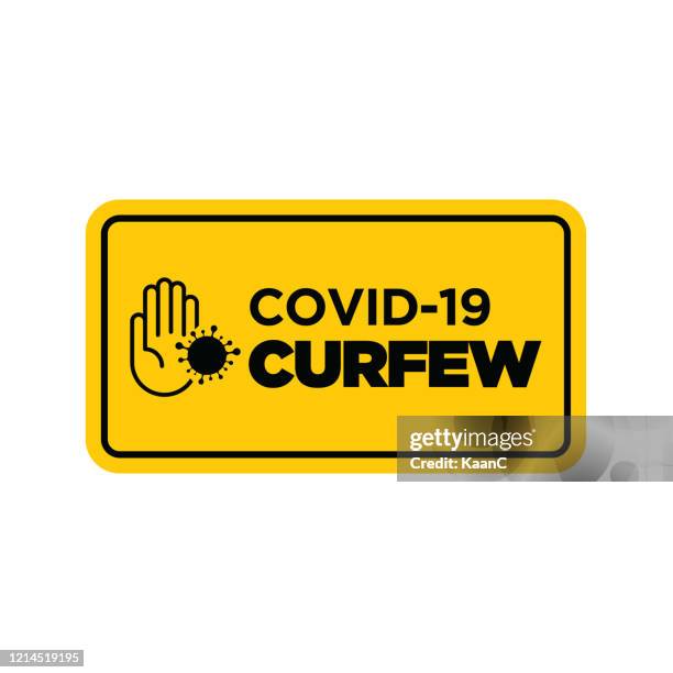 warning in a yellow sign about coronavirus or covid-19 vector illustration - curfew stock illustrations