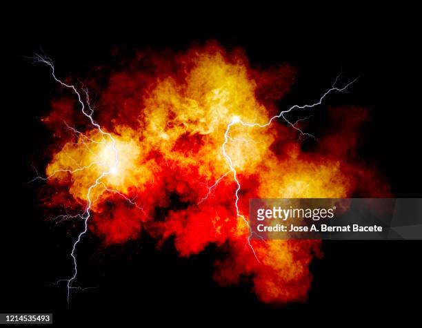 explosion by an impact of a cloud of particles of powder and smoke of multicolored on a black background. - electrical shock stockfoto's en -beelden