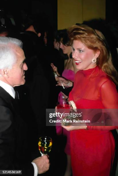 Georgette Mosbacher chats with Jack Valenti at black tie reception in Washington DC. 1989