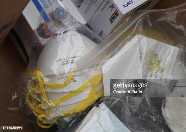 Nassau County police lead a donation drive to collect medical equipment such as N95 surgical masks, nitrile gloves, Tyvek suits and antibacterial and...