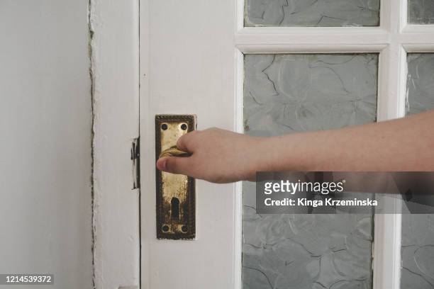 holding door handle - door handle stock pictures, royalty-free photos & images