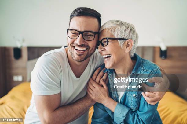 portrait of a mother and her adult son - old spectacles stock pictures, royalty-free photos & images