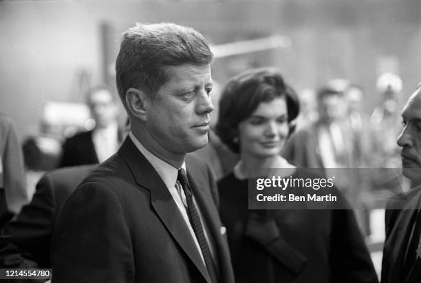 John F Kennedy and wife Jacqueline Kennedy arrive with advisors for split-screen telecast of the Presidential debate with Nixon and panelists in ABC...
