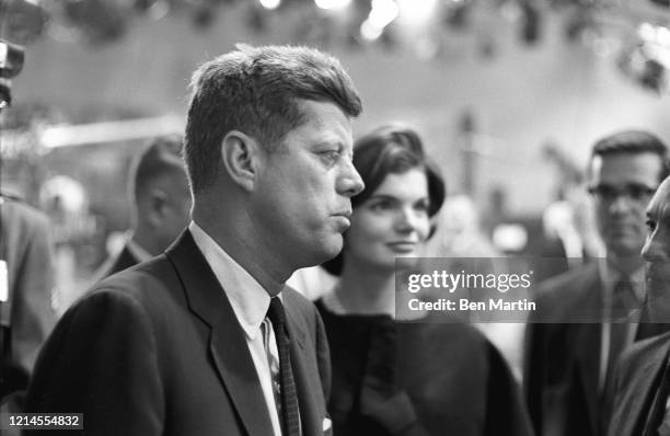 John F Kennedy and wife Jacqueline Kennedy arrive with advisors for split-screen telecast of the Presidential debate with Nixon and panelists in ABC...