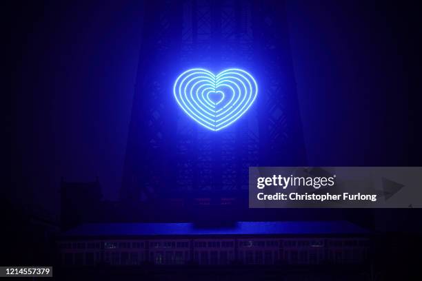 The iconic Blackpool Tower is adorned with a blue heart in honour of the British National Health Service and frontline staff who are fighting against...