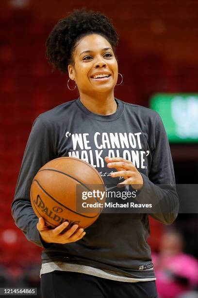 Assistant coach Lindsey Harding of the Sacramento Kings helps run a drill prior to the game against the Miami Heat at American Airlines Arena on...