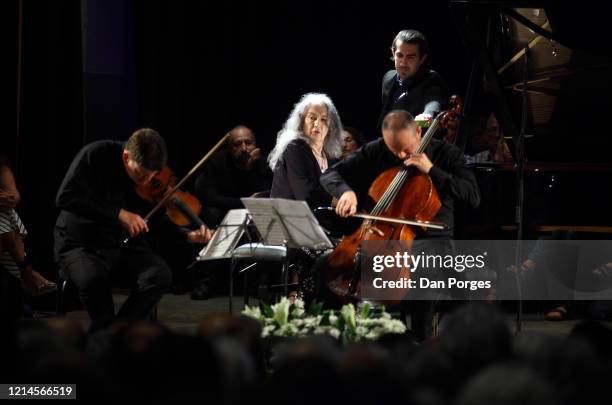 View of, from left, Guy Brauntein, on violin, Martha Argerich, on piano, and Kyril Zlotnikov, on double bass, as they perform onstage, during the...