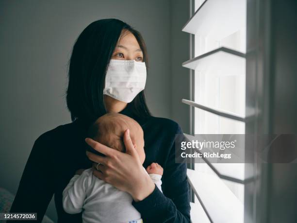 a mother and baby in home isolation from infectious disease. - quarantine stock pictures, royalty-free photos & images