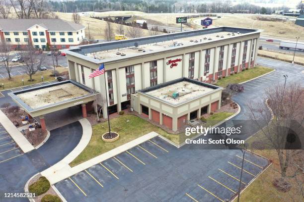The parking lot is nearly at a Hampton Inn hotel on March 24, 2020 in Rockford, Illinois. The American Hotel and Lodging Association anticipates the...
