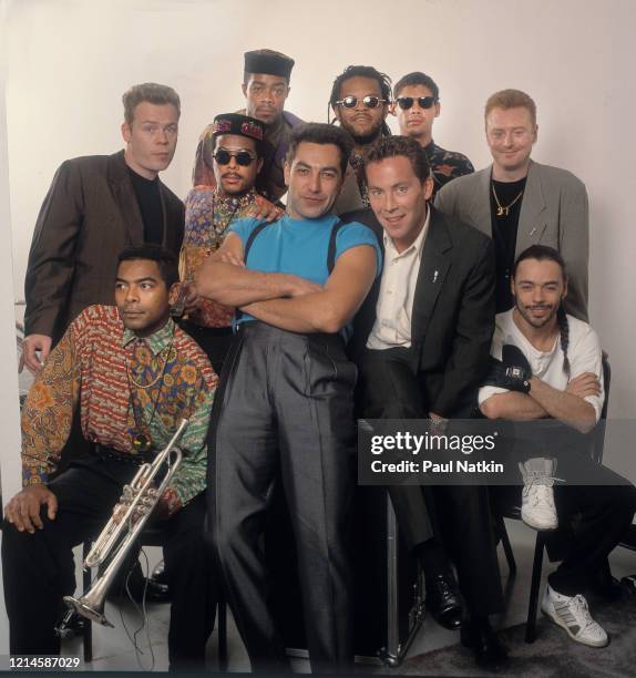 Portrait of the members of British Reggae and Pop group UB40 as they pose backstage at the Poplar Creek Music Theater, Hoffman Estates, Illinois,...