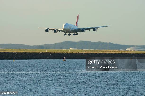 Qantas A380 lands at Sydney Airport on March 25, 2020 in Sydney, Australia. Prime Minister Scott Morrison has announced further restrictions on...