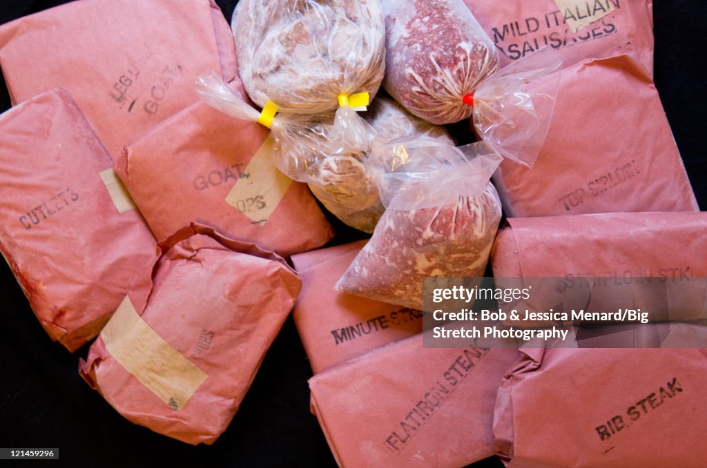 Variety of meat wrapped in butcher paper
