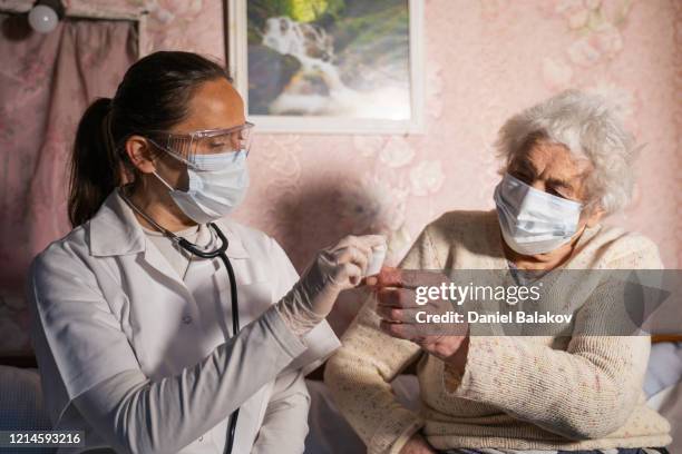 coronavirus protection. doctor's home visiting during the quarantine. - climate change health stock pictures, royalty-free photos & images