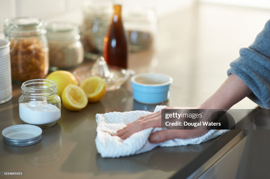 Cleaning kitchen with natural cleaning products.