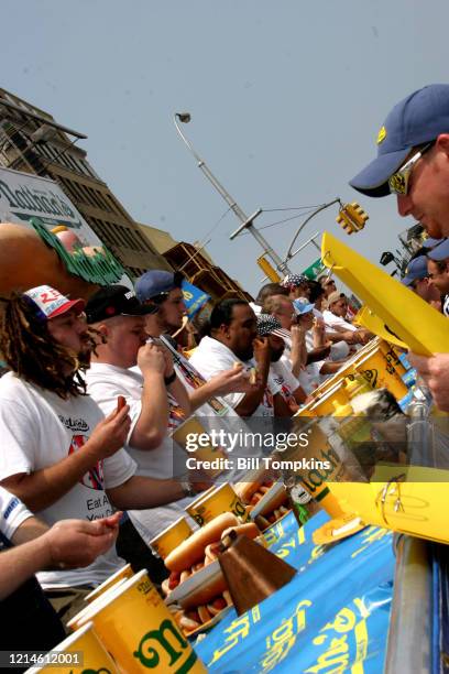 July 4: MANDATORY CREDIT Bill Tompkins/Getty Images Participants competing at the 2004 NATHANS Hot Dog Eating Contest. Coney Island, New York. July...