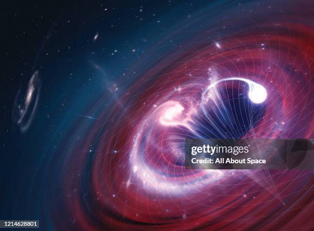 Illustration of objects being sucked into a black hole in space, created on February 17, 2016.