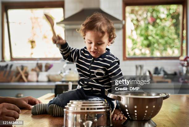 we have a drummer in the making - african drum stock pictures, royalty-free photos & images