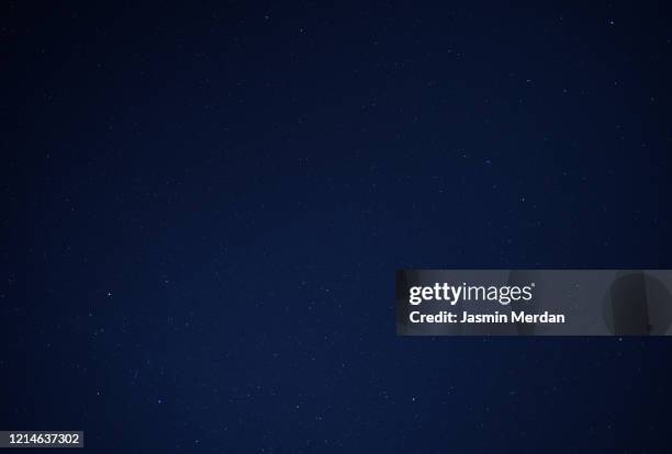 night sky with stars - navy blue abstract stock pictures, royalty-free photos & images