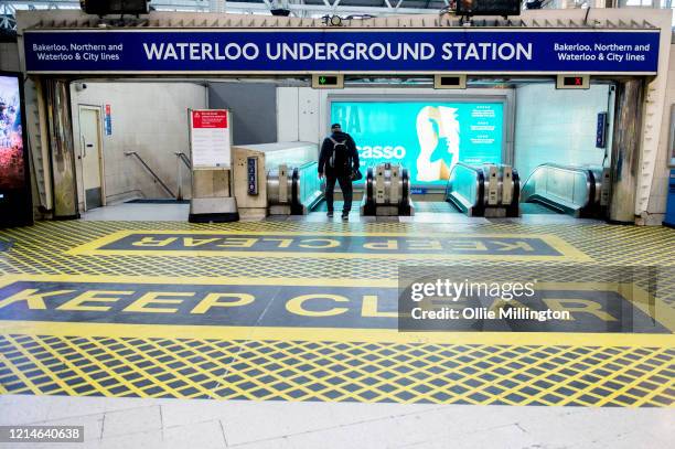 Waterloo Underground Station entrance almost empty during rush hour on March 24, 2020 in London. British Prime Minister, Boris Johnson, announced...