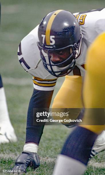 Defensive lineman Joe Greene of the Pittsburgh Steelers looks across the line of scrimmage at the Cleveland Browns during a game at Cleveland...