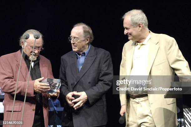 Acker Bilk receives an award from Chris Barber as Paul Gambaccini looks on during the BBC Jazz Awards at the Mermaid Theatre in London on 2nd July...