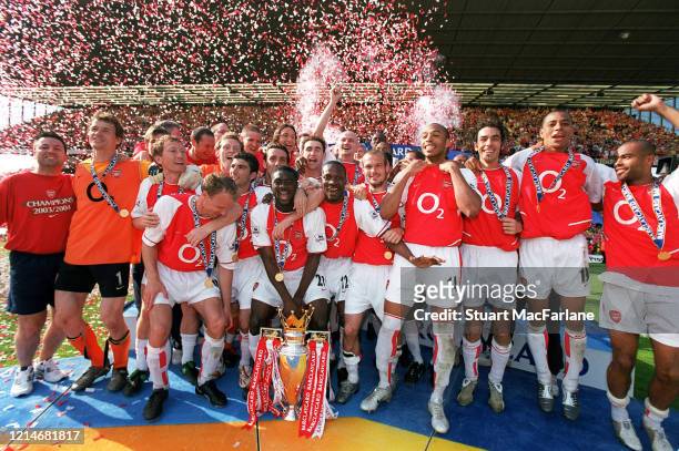 The Arsenal team with the Premier League Trophy after the Premier League match between Arsenal and Leicester City on May 15, 2004 in London, England.