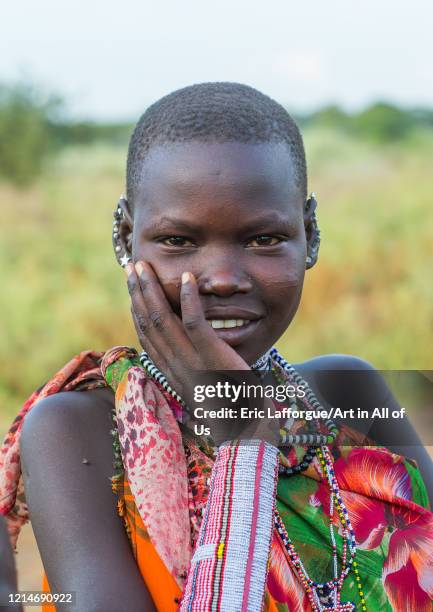 Toposa Fish Portrait of a Toposa tribe young woman wearing beaded necklace,... News ...