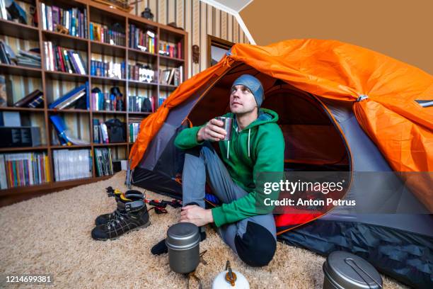 a young man in a tent inside the house. - the comedy tent stock pictures, royalty-free photos & images