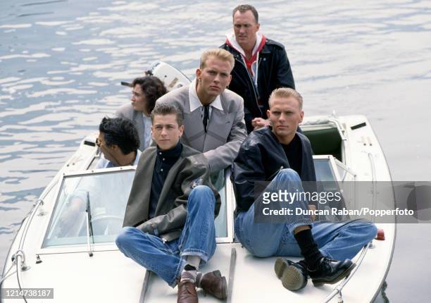 British band Bros Craig Logan, Matt Goss and Luke Goss on a boat during the Golden Rose Festival in Montreux, Switzerland circa May, 1988.