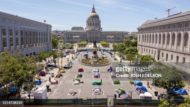 An aerial view shows squares painted on the ground to encourage homeless people to keep to social distancing at a city-sanctioned homeless encampment...