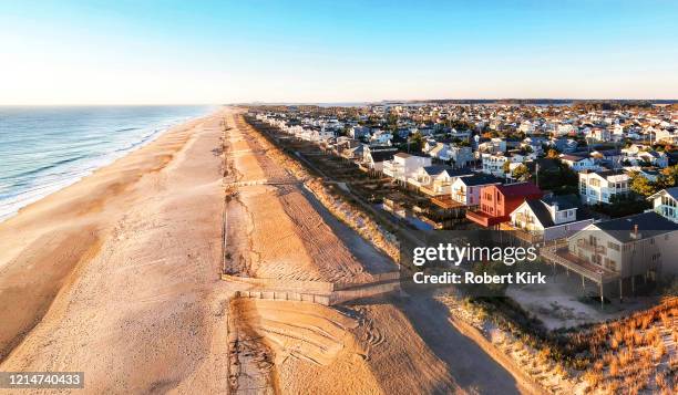 drone view of south bethany beach delaware and dune line constructed by the army corps of engineers - bethany beach stock pictures, royalty-free photos & images